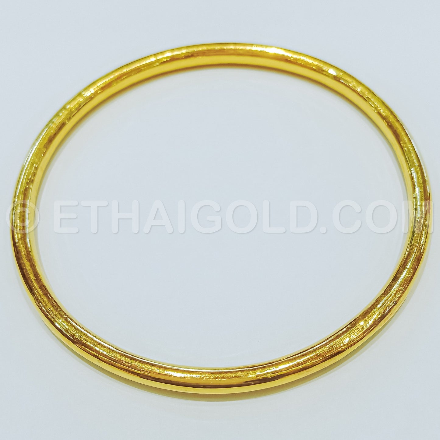 5 BAHT POLISHED HOLLOW ROUND SLIP-ON BANGLE BRACELET IN 23K GOLD (ID: B8005B)